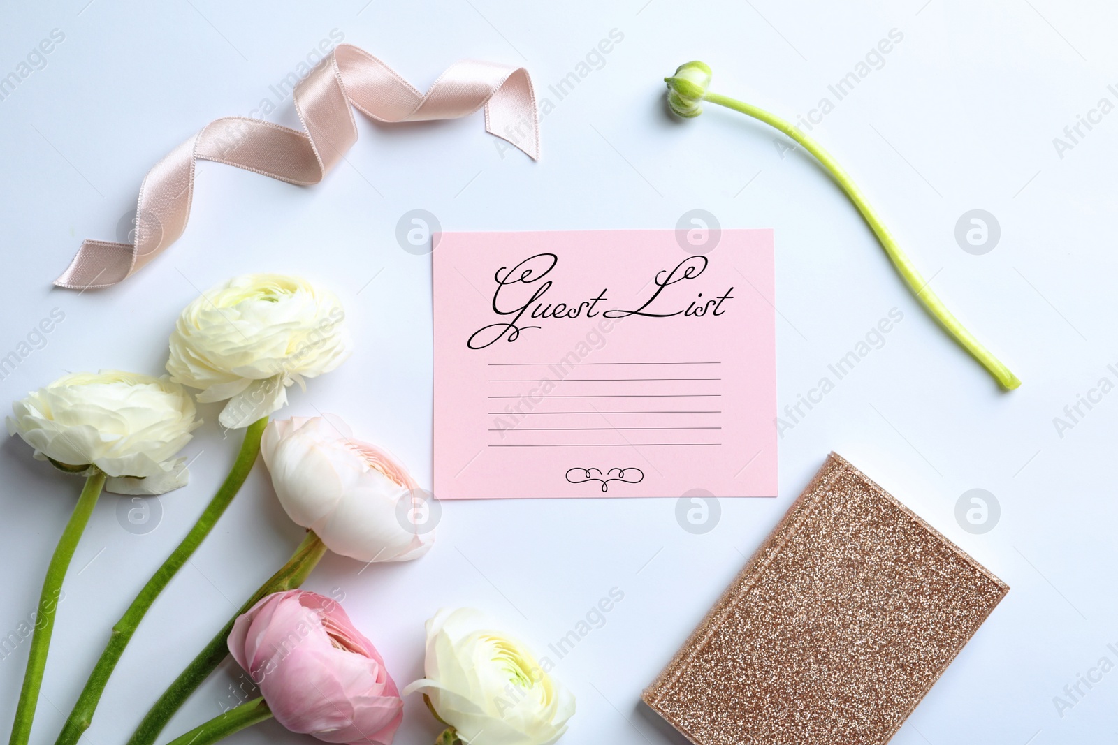 Image of Beautiful composition with guest list and flowers on white background, top view