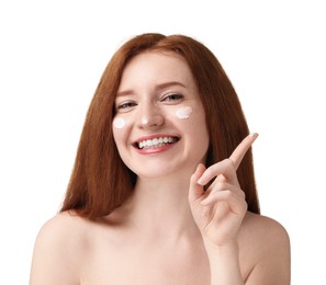 Photo of Smiling woman with freckles and cream on her face against white background, closeup