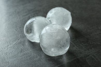 Photo of Frozen ice balls on dark grey table