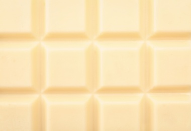 Photo of Delicious white chocolate bar as background