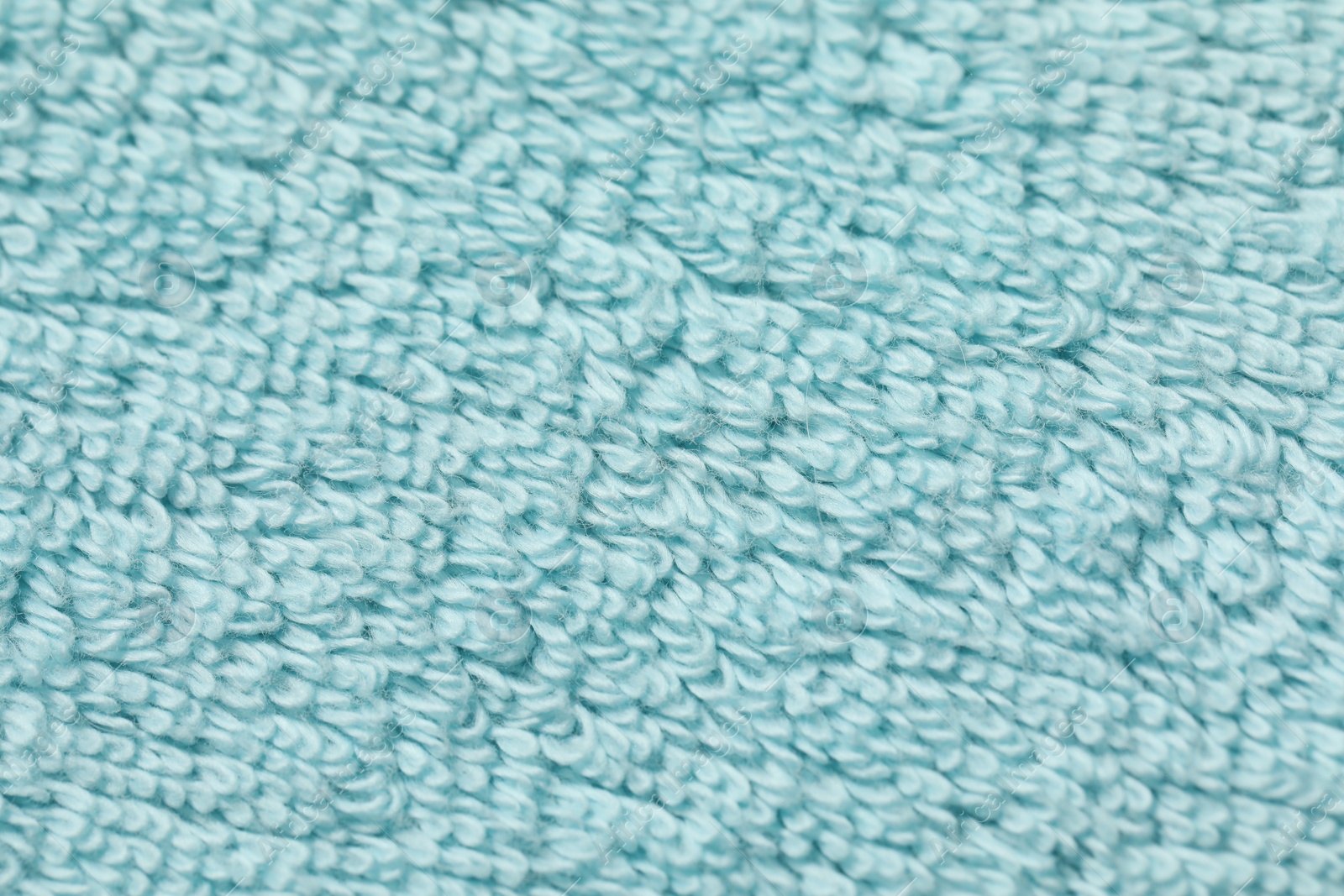 Photo of Texture of soft light blue fabric as background, top view