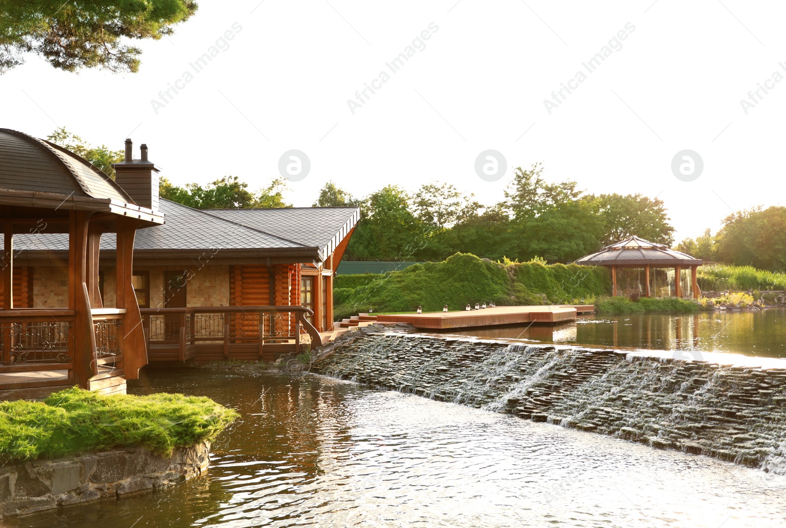 Photo of Picturesque landscape with beautiful lake on sunny day. Gardening idea