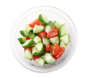 Delicious fresh cucumber tomato salad in bowl on white background, top view