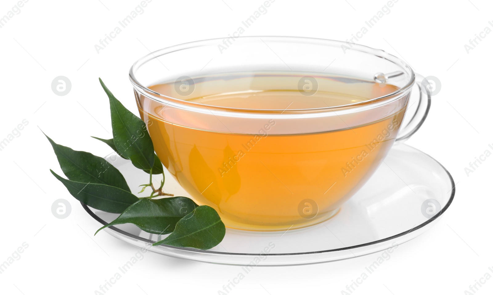 Photo of Fresh green tea in glass cup, leaves and saucer isolated on white