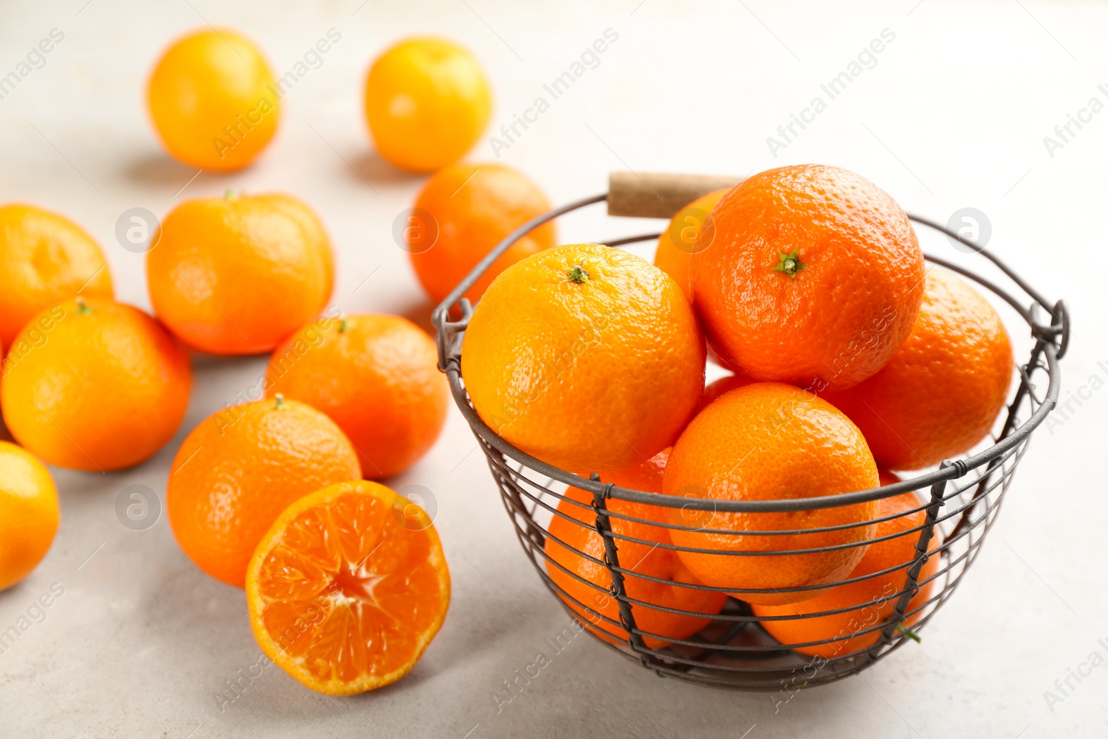 Photo of Fresh ripe tangerines on light table, closeup
