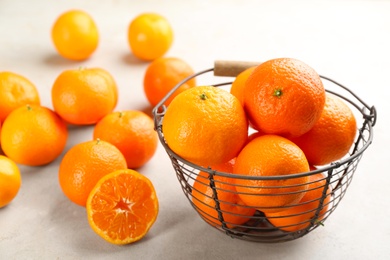 Fresh ripe tangerines on light table, closeup