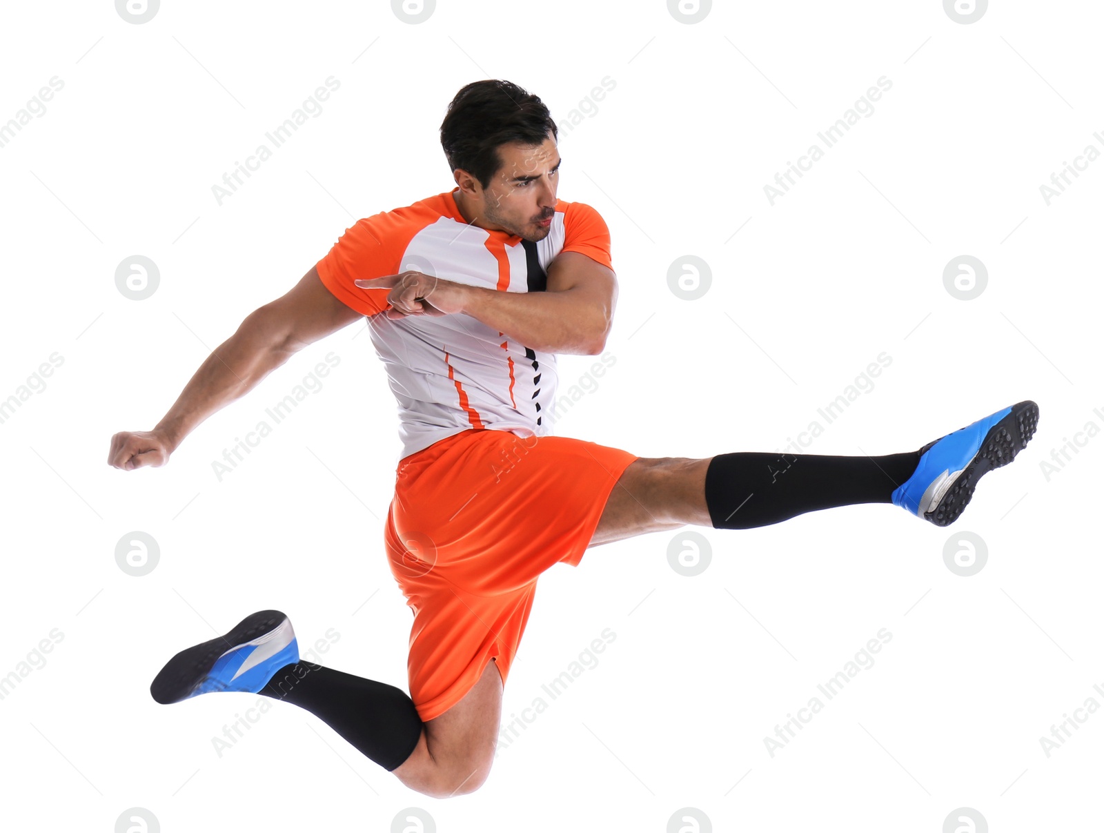 Photo of Young man playing football on white background