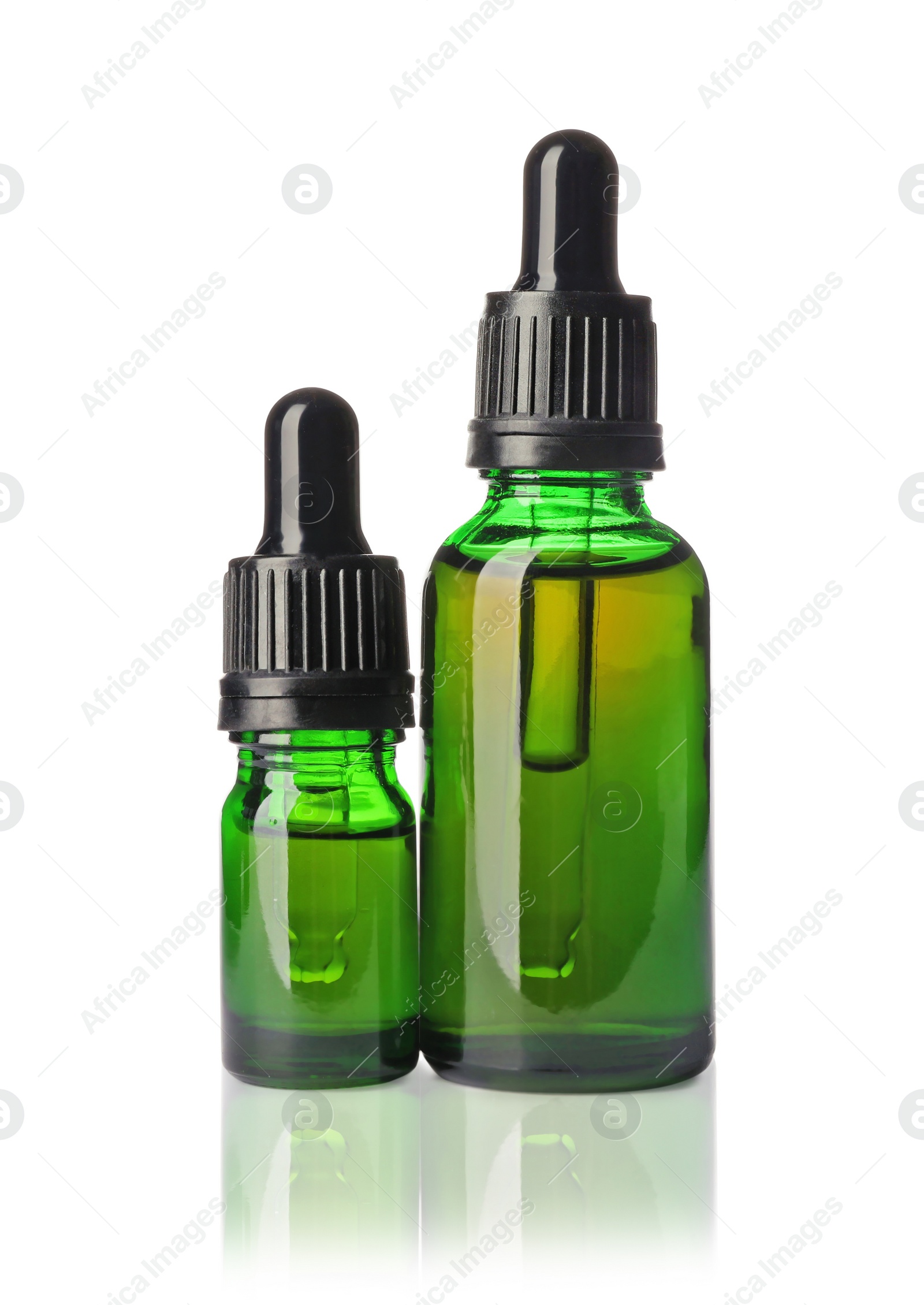 Photo of Cosmetic bottles of essential oils on white background