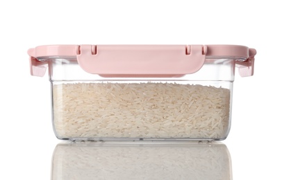 Box with uncooked rice on white background