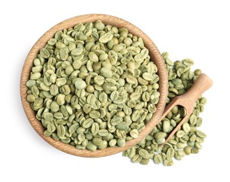 Photo of Wooden bowl and scoop with green coffee beans on white background, top view