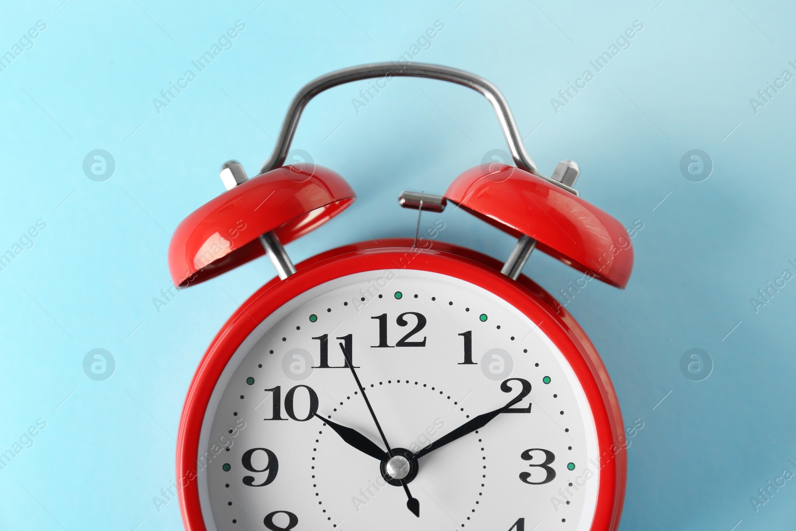 Photo of Alarm clock on color background. Time change concept