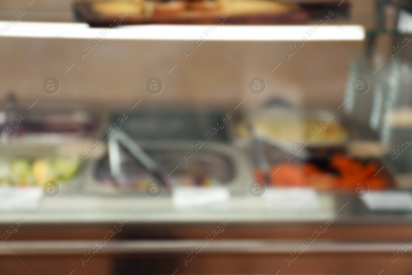 Photo of Blurred view of serving line with food in school canteen