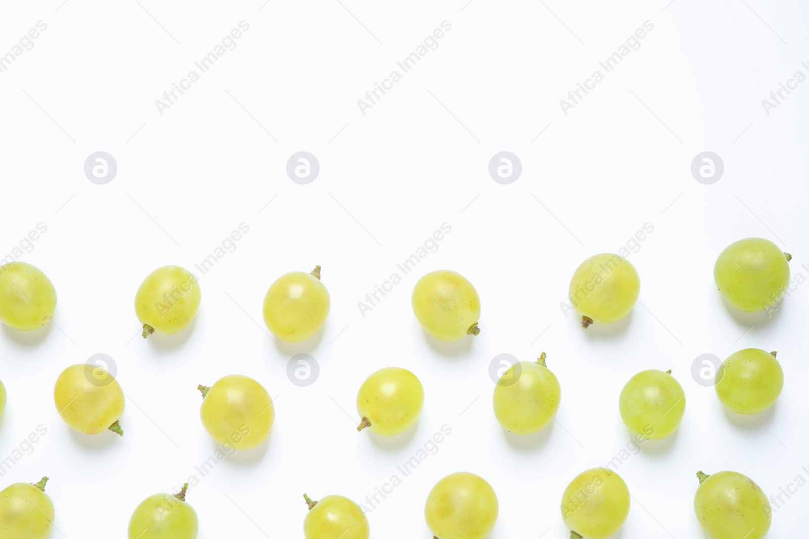 Photo of Fresh ripe juicy grapes on white background, top view