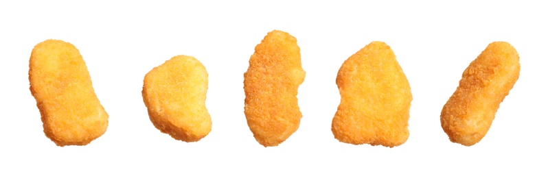 Set of fresh chicken nuggets on white background