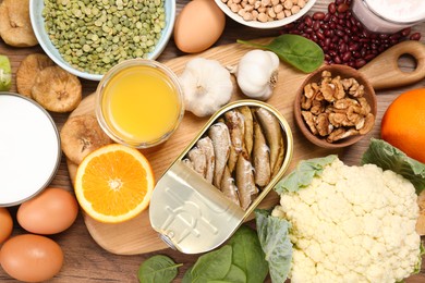 Photo of Set of natural food on wooden table, flat lay