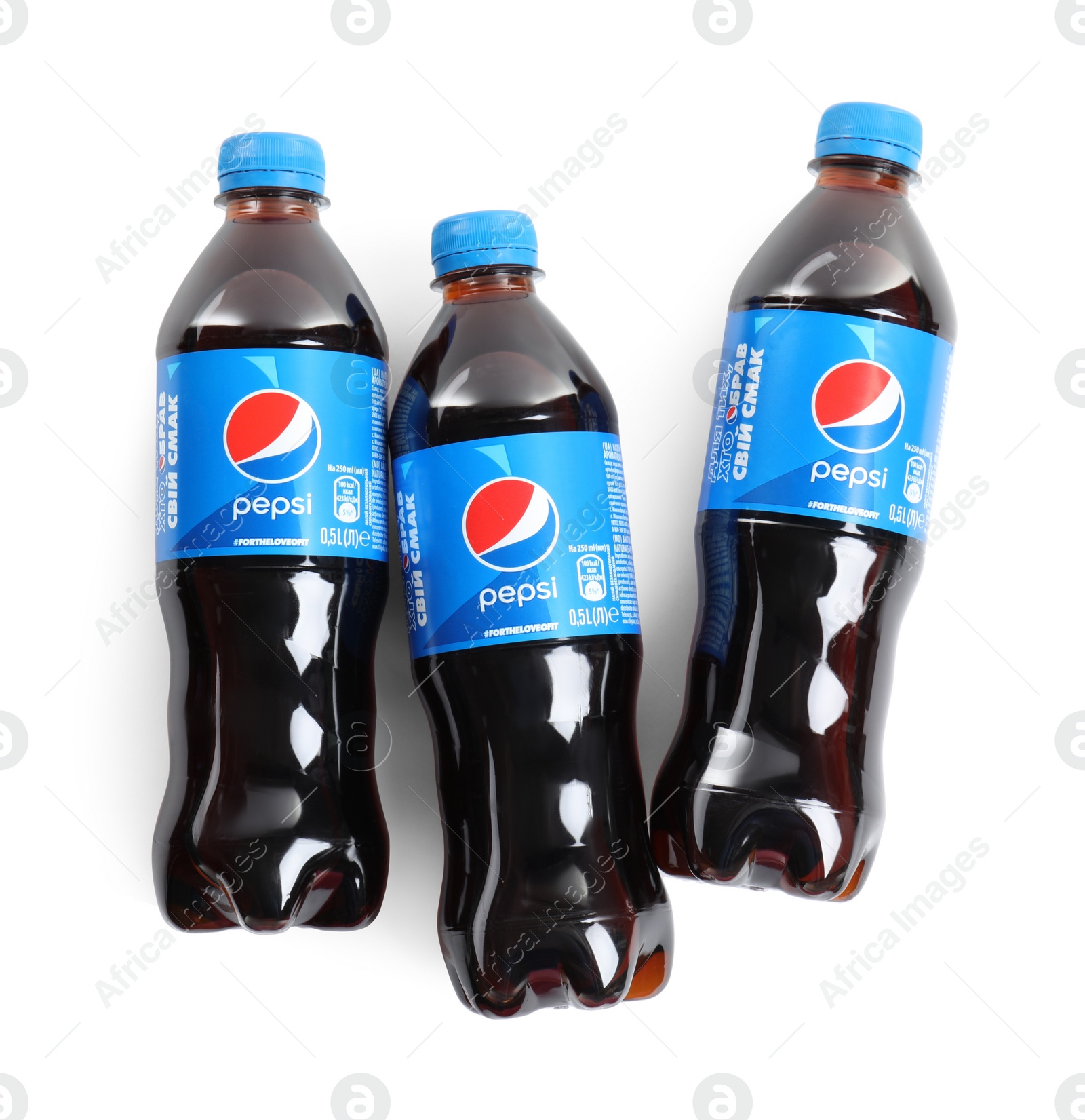 Photo of MYKOLAIV, UKRAINE - FEBRUARY 10, 2021: Bottles of Pepsi on white background, top view