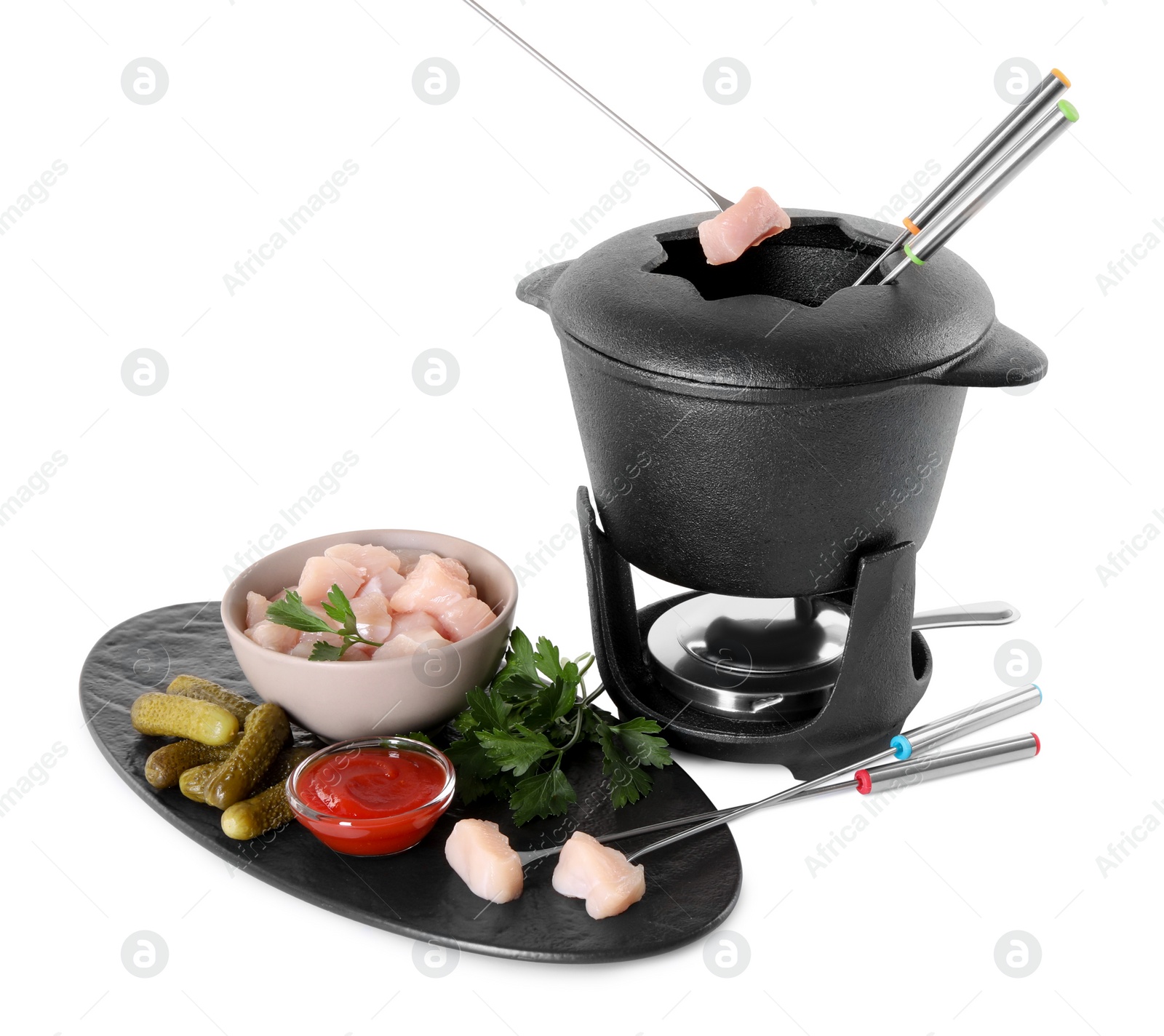 Photo of Dipping piece of raw meat into oil in fondue pot on white background