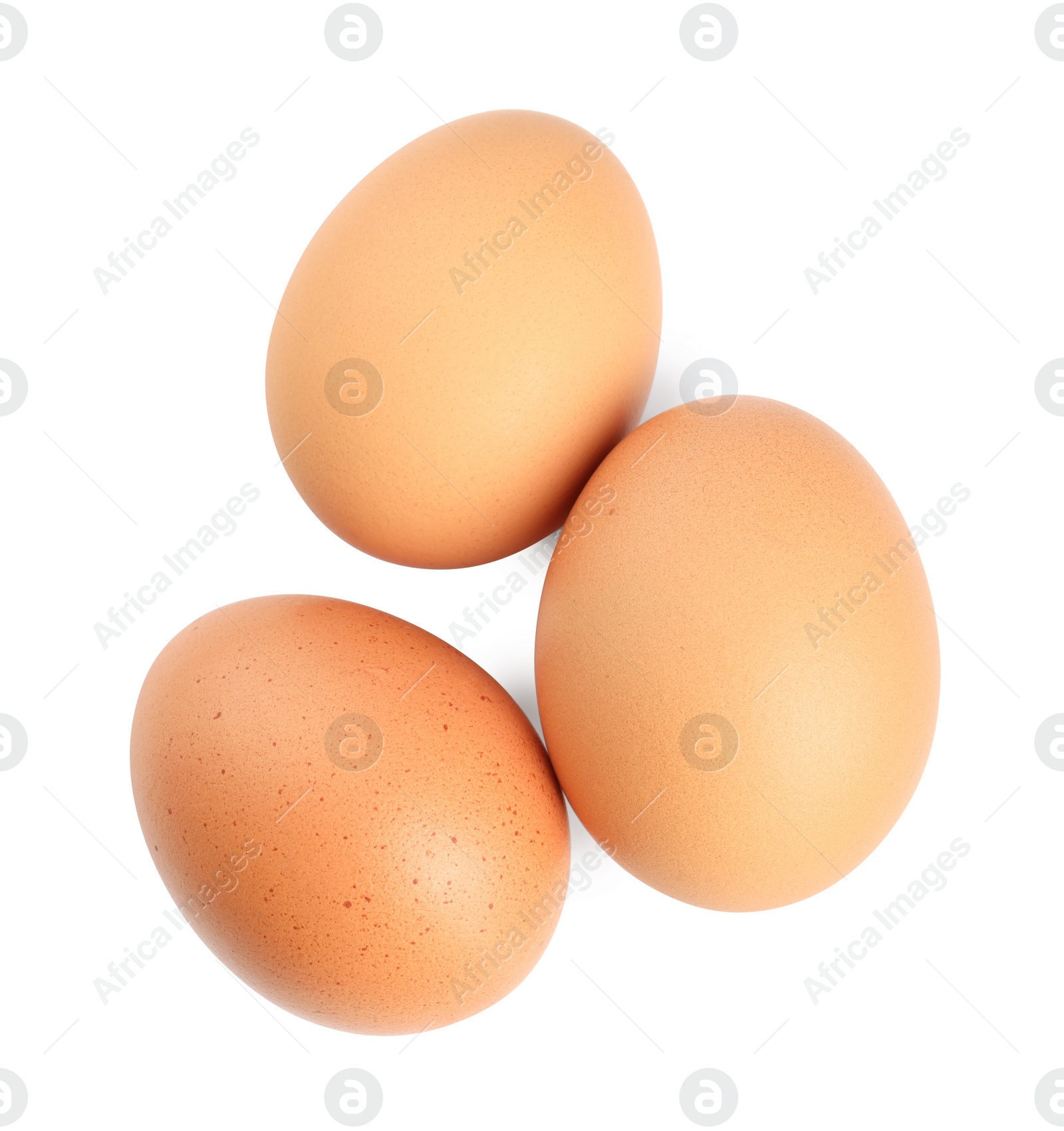 Photo of Three raw chicken eggs isolated on white, top view