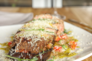 Photo of Delicious roasted meat served on table, closeup