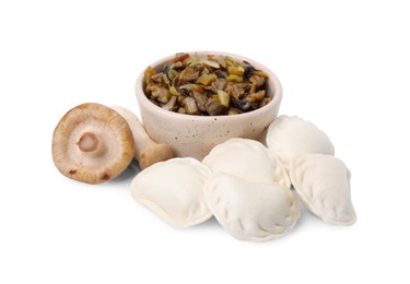 Raw dumplings (varenyky) and cooked mushrooms isolated on white