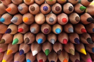 Different color pencils as background, top view