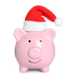 Photo of Cute piggy bank with Santa hat on white background