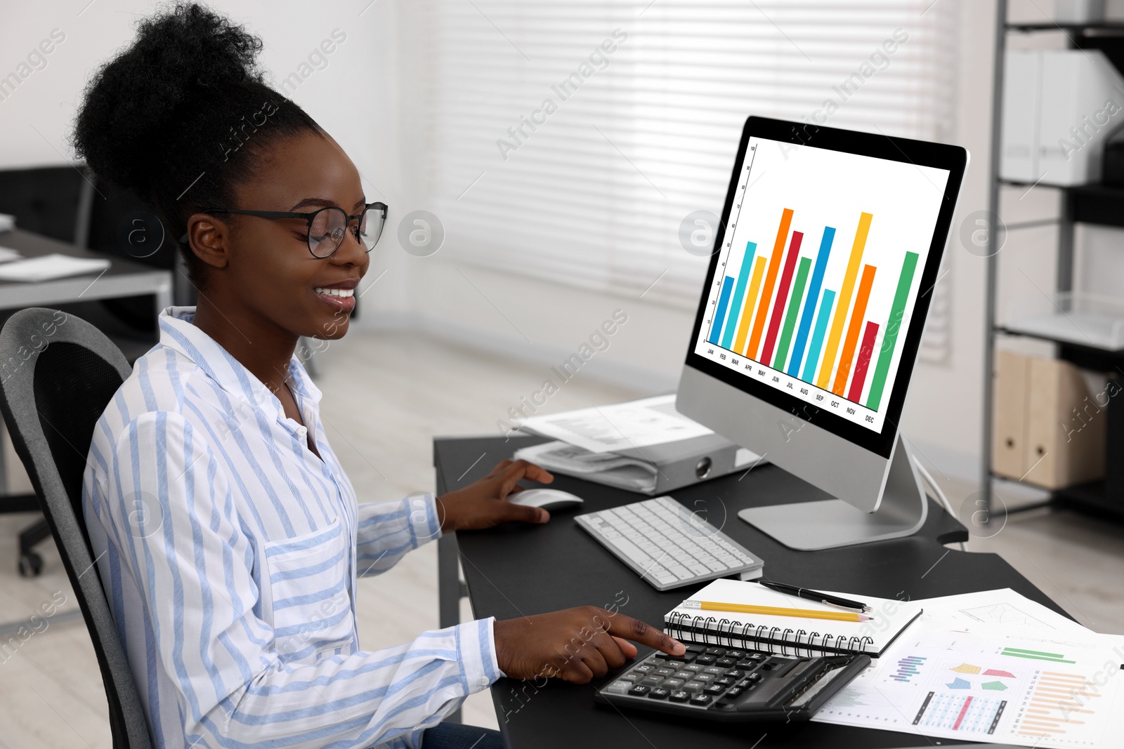 Photo of Professional accountant working at desk in office