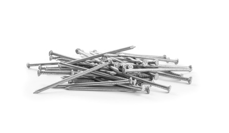 Photo of Pile of metal nails on white background