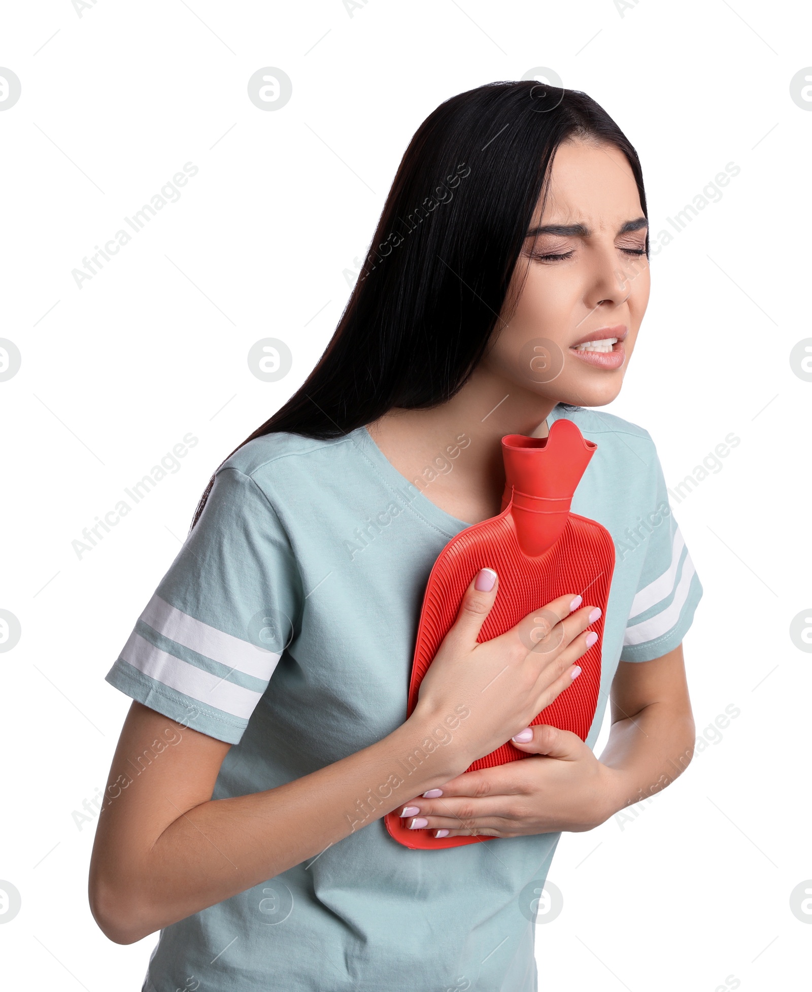 Photo of Woman using hot water bottle to relieve chest pain on white background