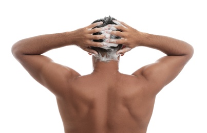 Man washing hair on white background, back view