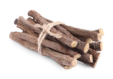 Photo of Dried sticks of liquorice root on white background