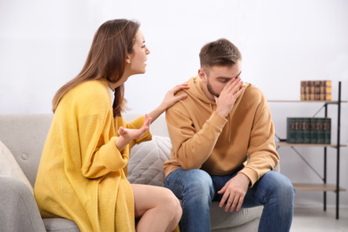 Photo of Couple having quarrel at home. Relationship problems