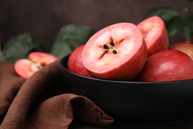 Tasty apples with red pulp on table, closeup