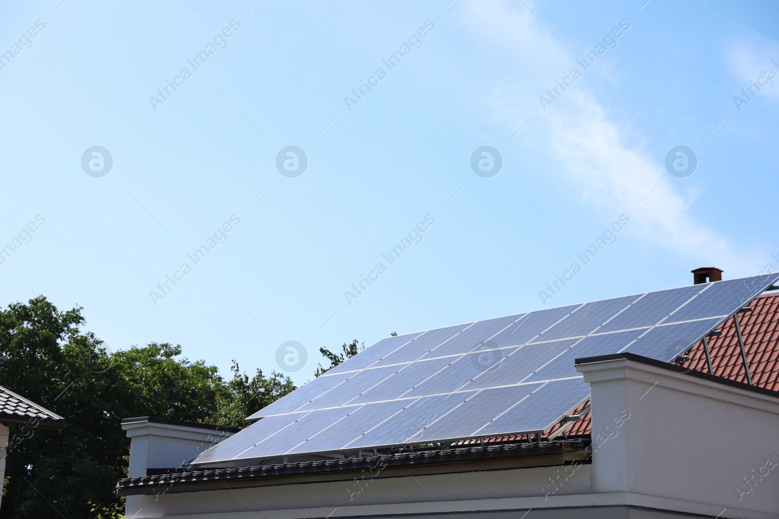 Photo of Modern house roof with solar panels outdoors