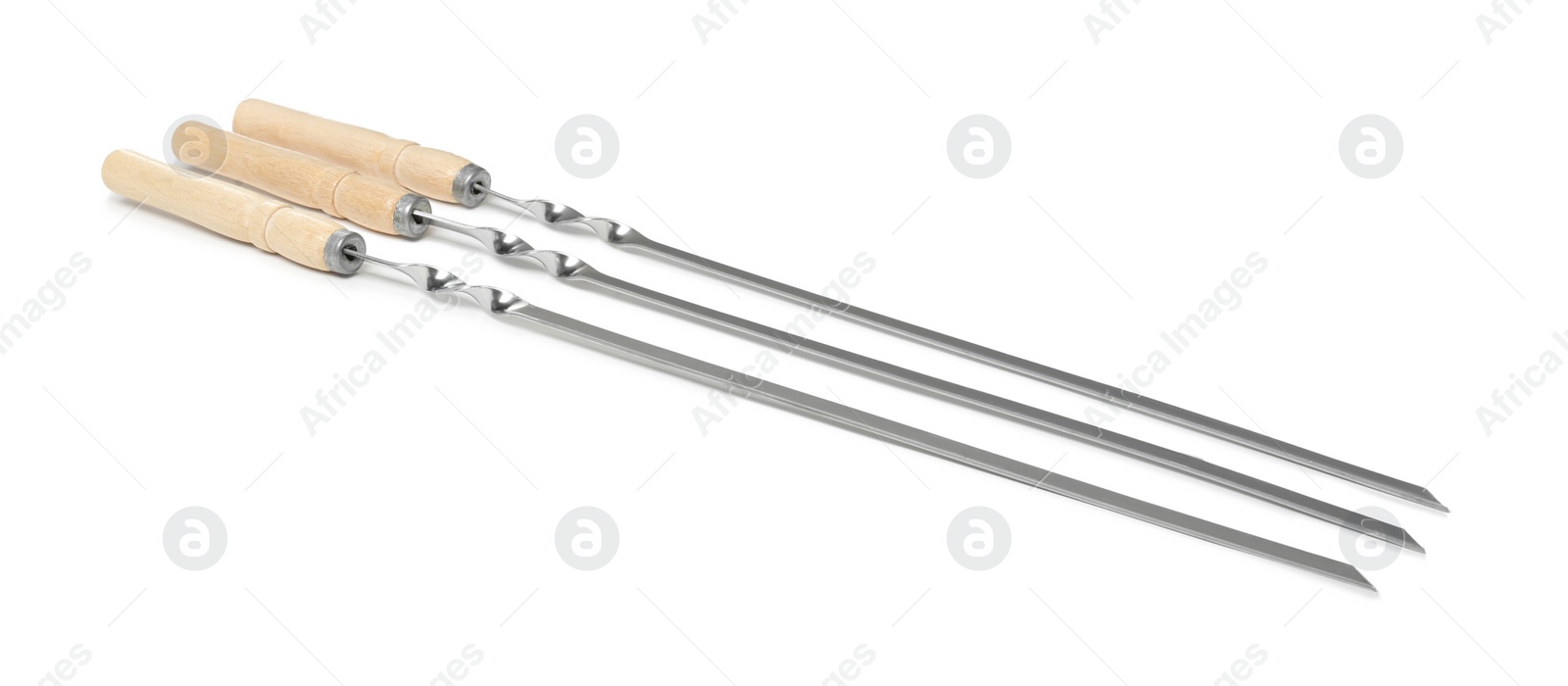 Photo of Metal skewers with wooden handle on white background