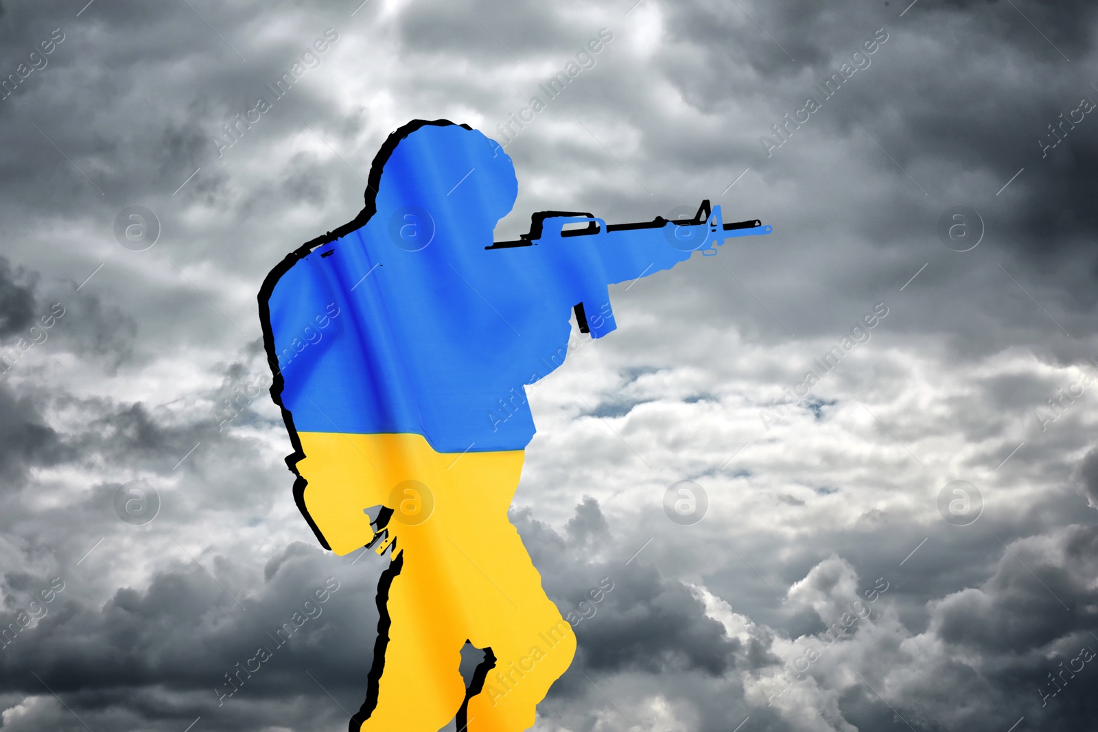 Image of Silhouette of soldier in color of Ukrainian flag with assault rifle against cloudy sky