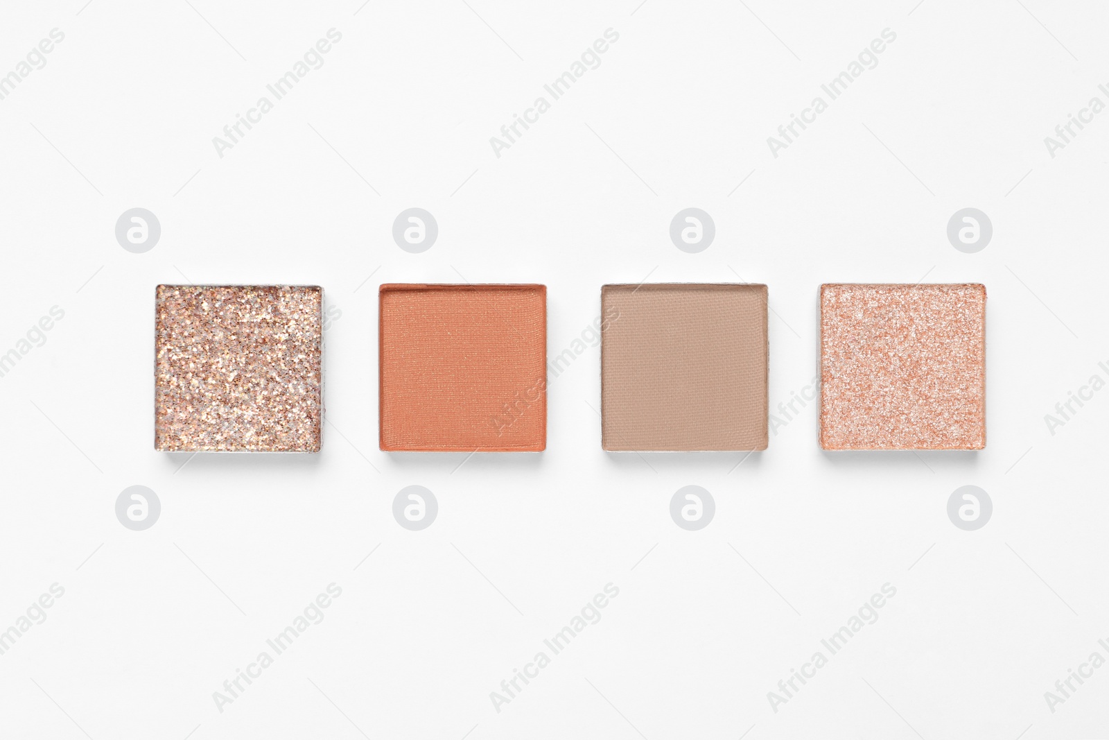 Photo of Different beautiful eye shadows on white background, flat lay