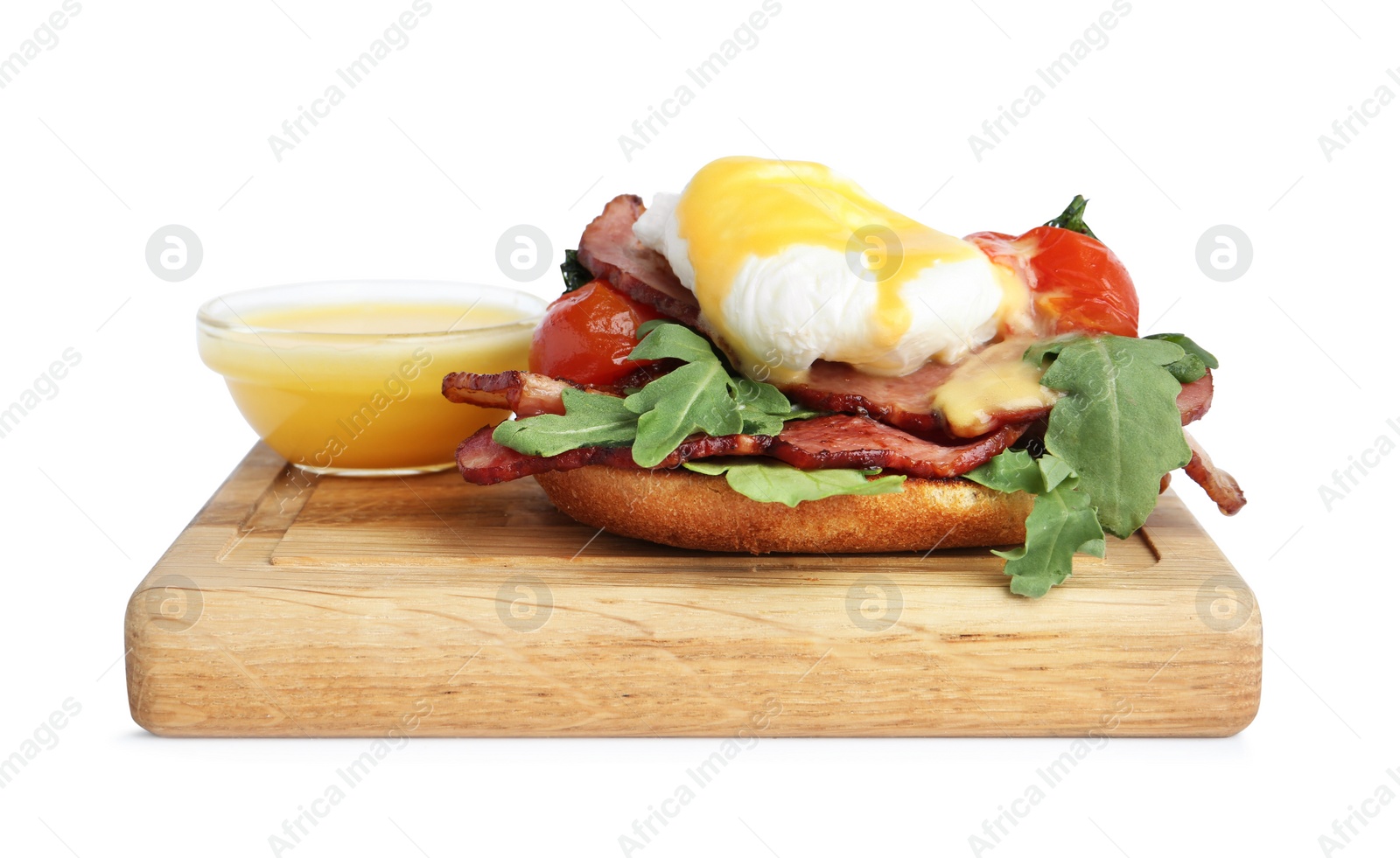 Photo of Delicious egg Benedict with sauce isolated on white