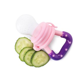 Photo of Empty nibbler and cut cucumber on white background, top view. Baby feeder