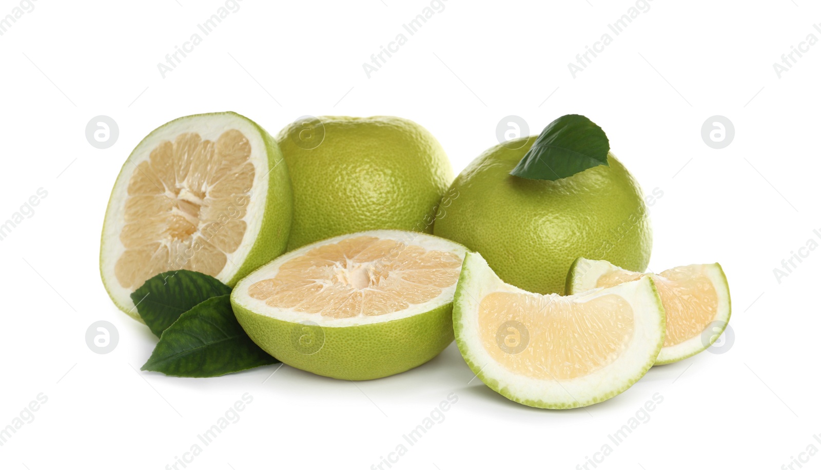 Photo of Whole and cut sweetie fruits with green leaves on white background