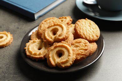 Photo of Plate with Danish butter cookies on table