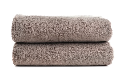 Photo of Fresh soft folded towels isolated on white