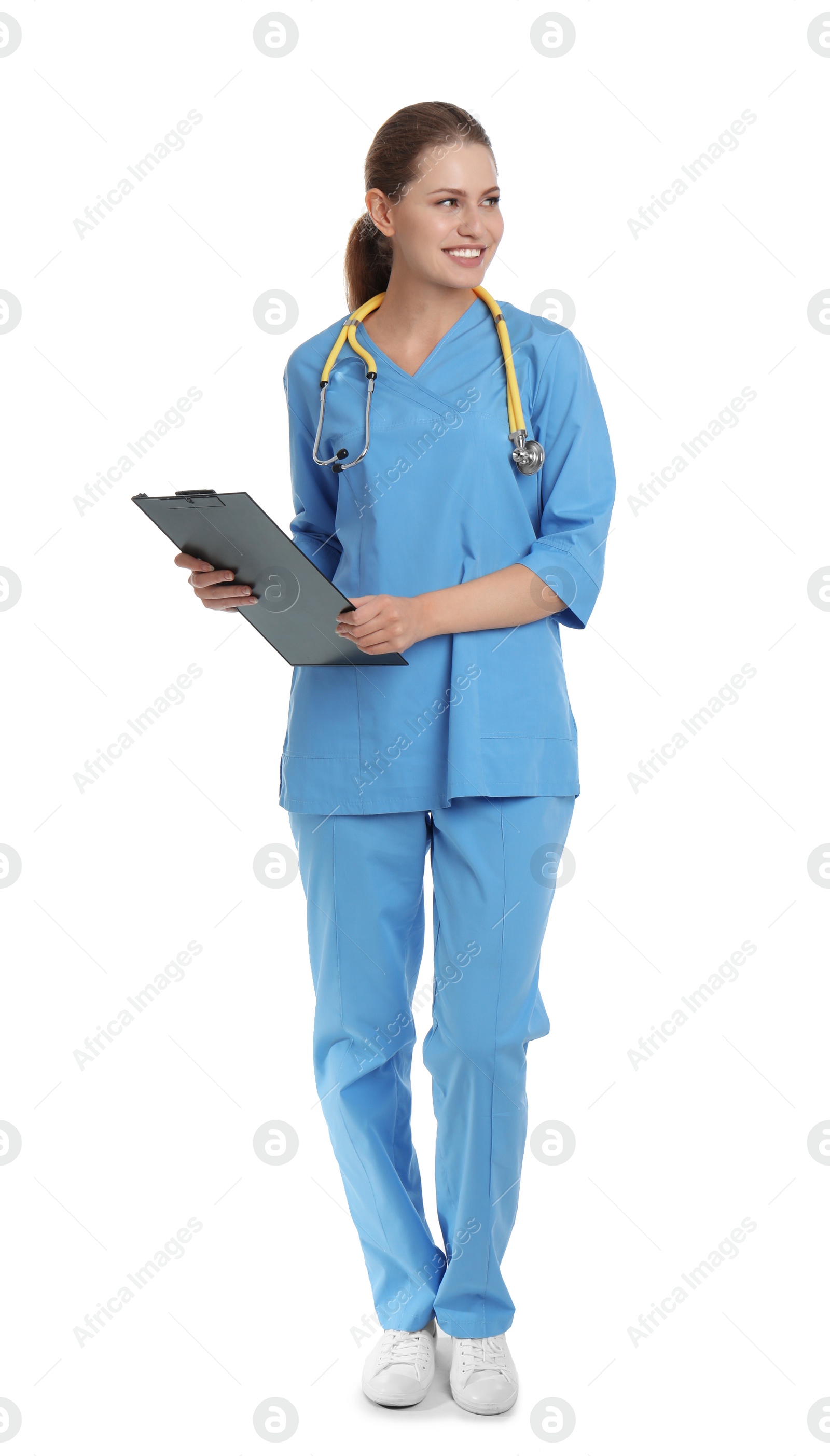 Photo of Full length portrait of young medical assistant with stethoscope and clipboard on white background