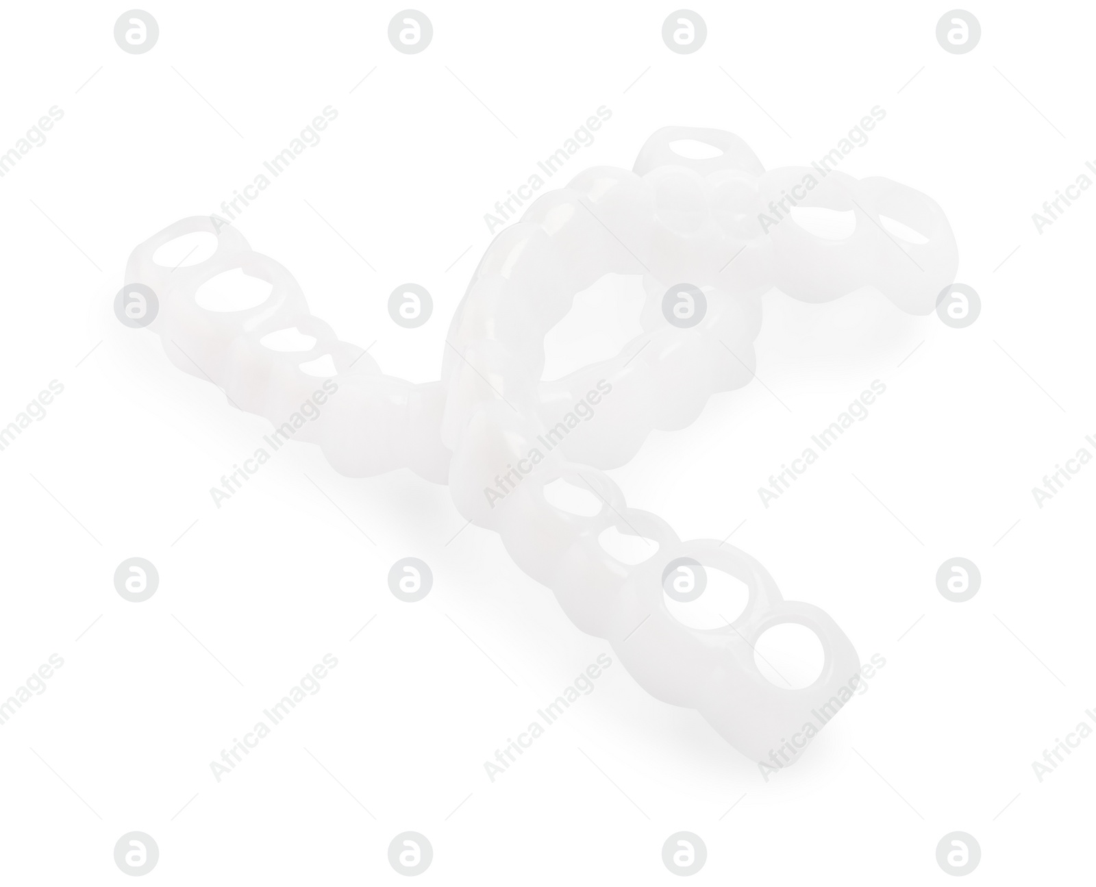 Photo of Dental mouth guards on white background. Bite correction