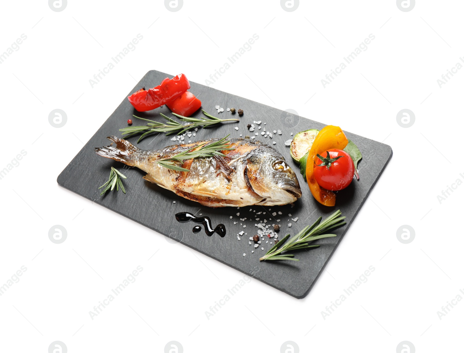 Photo of Delicious roasted fish and vegetables isolated on white