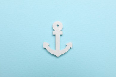 Photo of Anchor figure on pale blue background, top view
