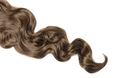 Photo of Lock of brown wavy hair on white background, top view