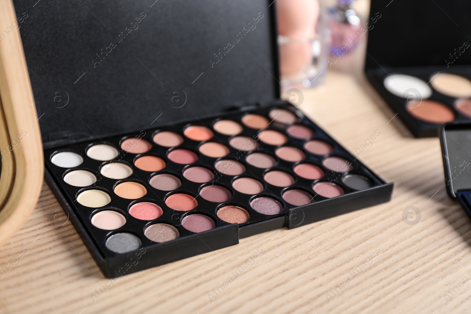 Photo of Large eye shadow palette on dressing table
