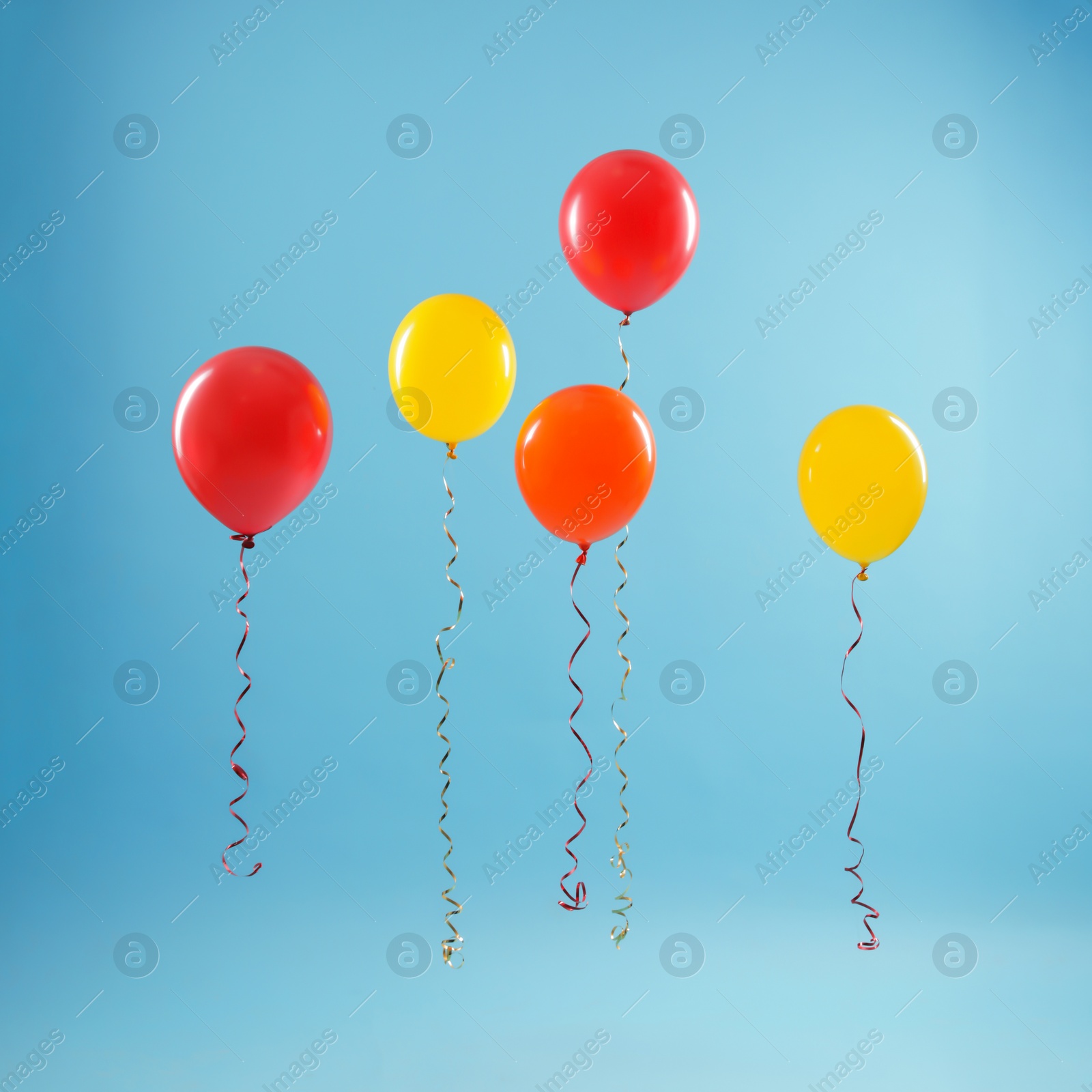 Photo of Bright balloons on color background. Celebration time