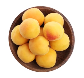 Delicious ripe apricots in wooden bowl isolated on white, top view